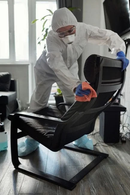 Minimalist desk with a focus on a multipurpose cleaner, office supplies, and storage solutions.
